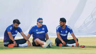 Arshdeep Singh and Akash Deep playfully wrestle with bowling coach Morne Morkel during Team India net session