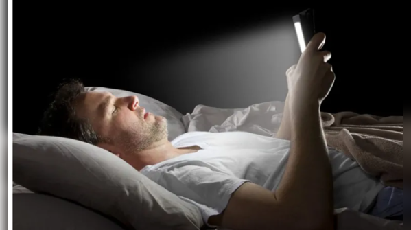 Electronic devices emitting blue light near a bed