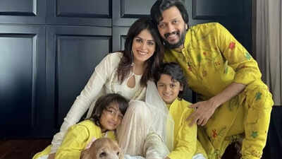 Riteish Deshmukh with his family, acknowledging photographers.