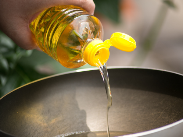 A bottle of vegetable oil on a table.